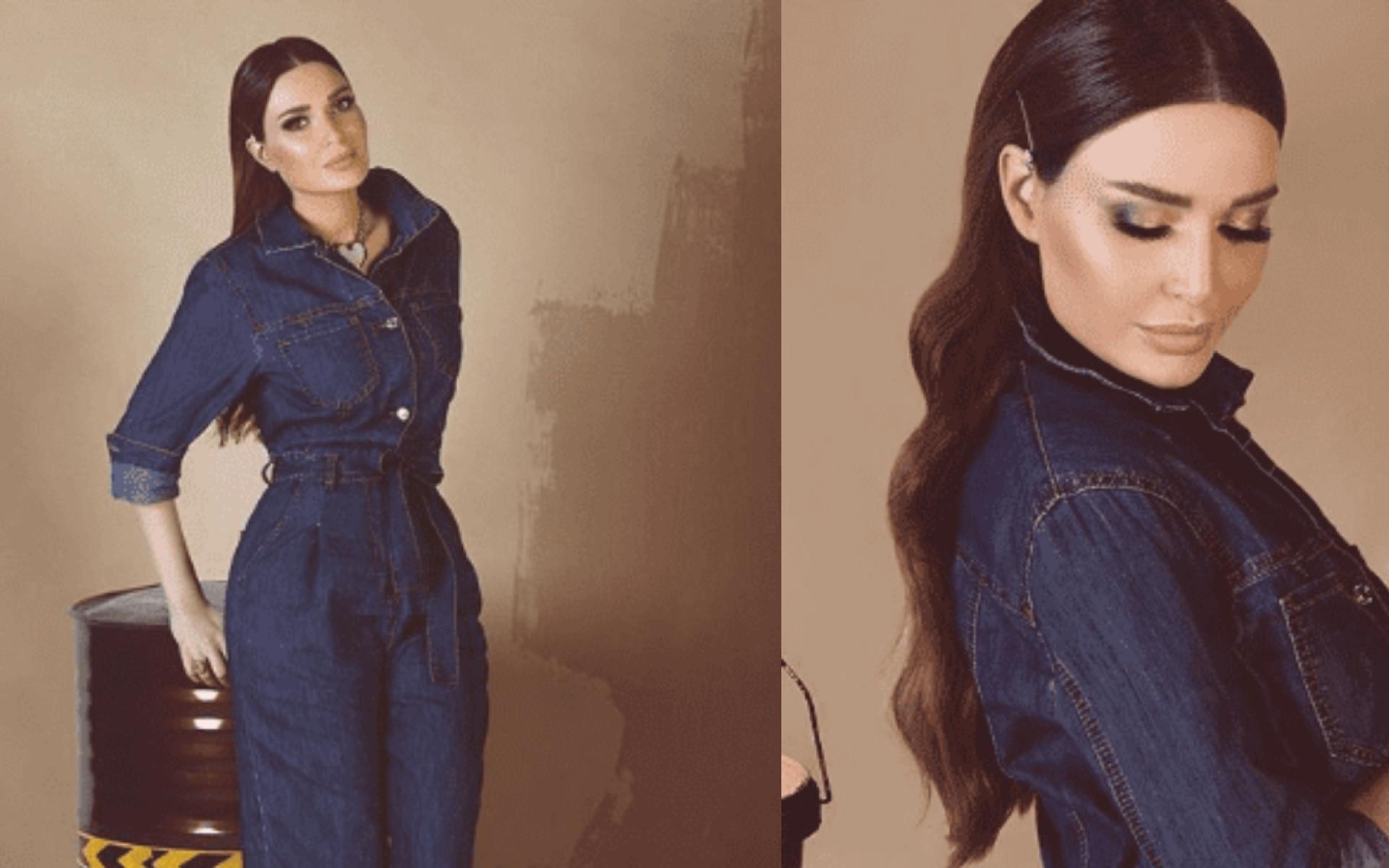 جمبسوت جينز باللون الأزرق أبرز منحنيات جسمها بطريقة جميلة